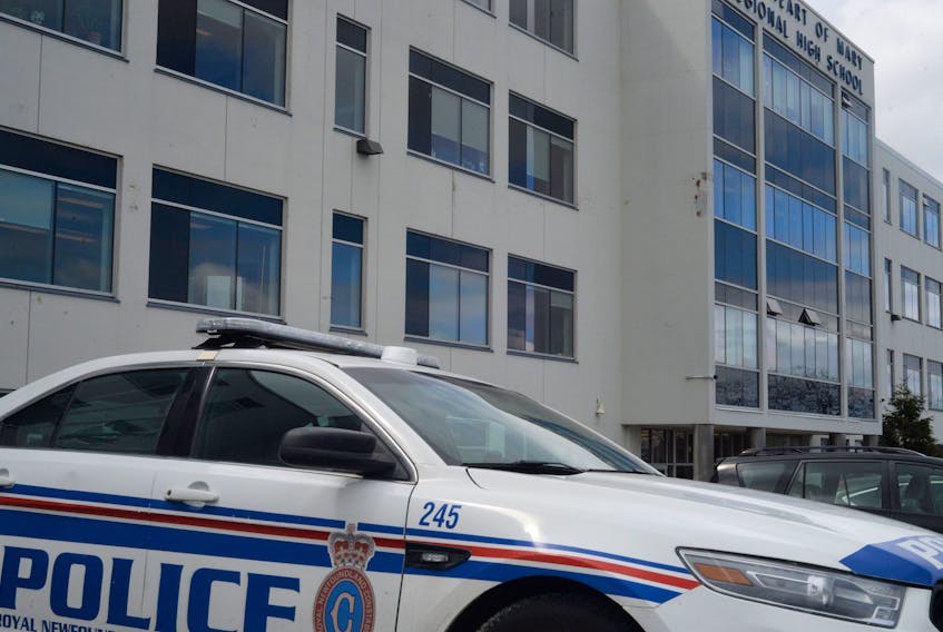 A police cruise is seen outside  Holy Heart of Mary High School in St. John's over the lunch hour Thursday. Several schools were placed into "safe mode," after a threat was received. Police later arrested a 19-year-old male ion connection with the incident.
