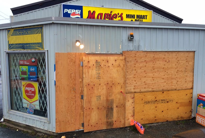 The Marie's Mini Mart on Torbay Road near Stavanger Drive suffered extensive damage from a car that crashed into the storefront during a robbery early Tuesday morning.