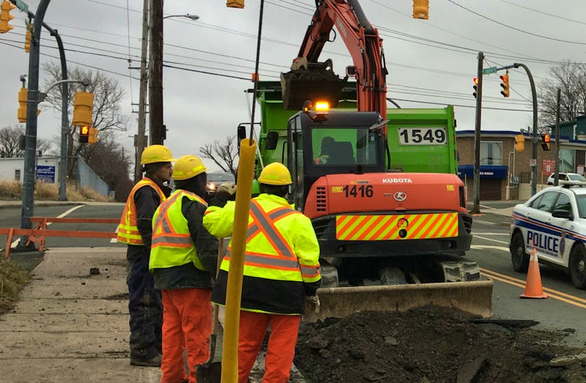 City workers repair a water main on Lemarchant Road in a file photo. Work to upgrade systems in the Rabbittown area is slated to begin in April.