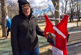 Rosie Hoskins, first cousin of Conner River's Chantele John, who was murdered in January, placed a red dress on a tree in Bannerman Park on Wednesday, which would have been John's 29th. birthday.