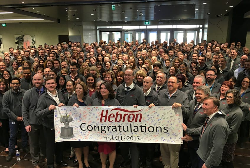 Hebron project workers and invited guests gather for a group photo following the celebration of first oil having been produced at the $14 billion platform. — Kenn Oliver