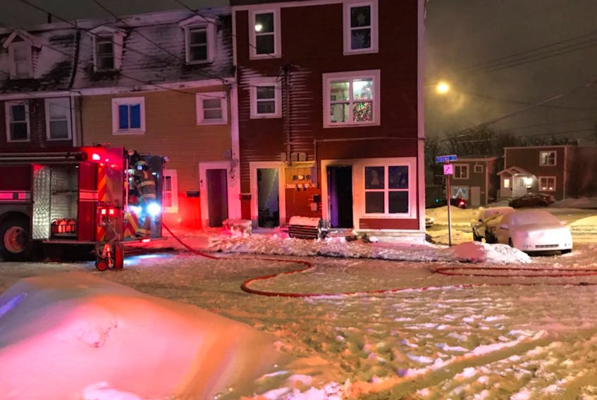 A fire in a three-apartment attached dwelling Saturday night has left five people without accomodation. — Photo courtesy of Canadian Red Cross