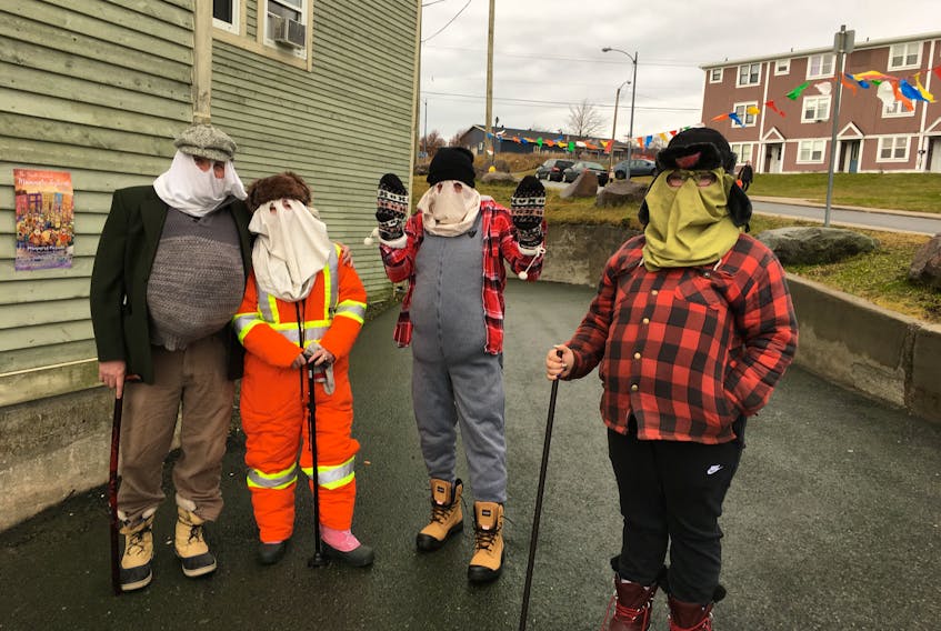 Folks get ready to go mummering at the St. John's Recreation Centre in Buckmasters Circle Saturday. — David Maher photos