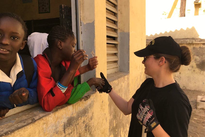 Emmie Penney’s work in promoting women in non-traditional roles gained her at least one fan while volunteering at a school in Dakar, Senegal. This young girl spent the day with Penney. “My rusty French somehow forged a friendship and she followed me the whole day fixing desks,” Penney said.