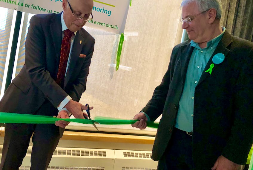 Health and Community Services Minister John Haggie and Canadian Mental Health Association of Newfoundland and Labrador CEO Dan Goodyear cut the ribbon to launch Mental Health Week, with activities beginning Monday.