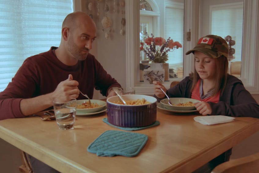 Clint Butler as Simon and Kate Dobbin as Scout have a discussion at the breakfast table in a scene from Joshua Jamieson’s latest short film “Waiting Outside …”