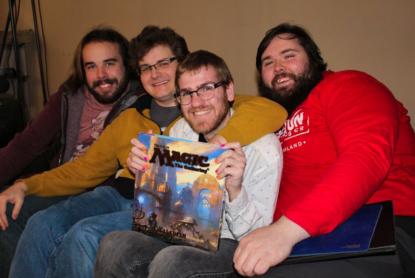 Pictured are Sandbox Gaming members posing for a photo before a live-streamed game of Magic: The Gathering. From left to right: Thomas Rahal, Erik Peterson, Adam Power and Dylan Hardy.