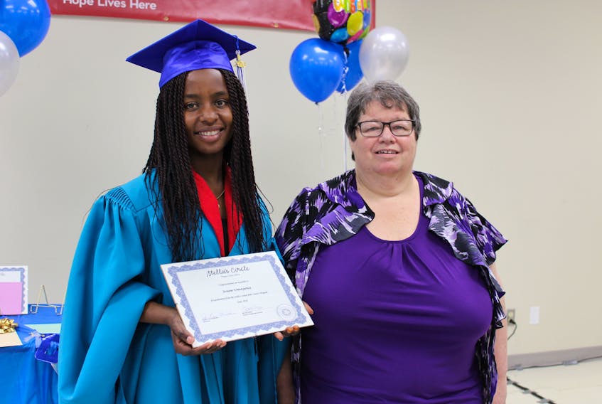 Josiane Umunyurwa (left), a refugee from The Congo graduated from the Adult Basic Education (ABE) Level I program at Stella’s Circle on Tuesday. She and a host of her fellow graduates were treated to a guest speaker and former graduate of the same program — Linda Richards — who credited the program with helping her get her life back on track.
