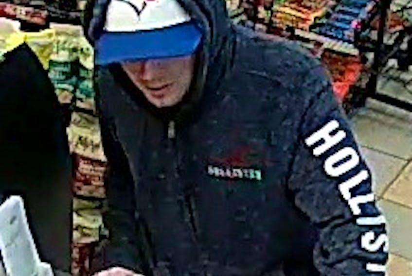 The man is described as about 6’ tall with blue eyes. At the time of the robbery, he was wearing a black hoodie, a Blue Jays hat, and light coloured jogging pants.
