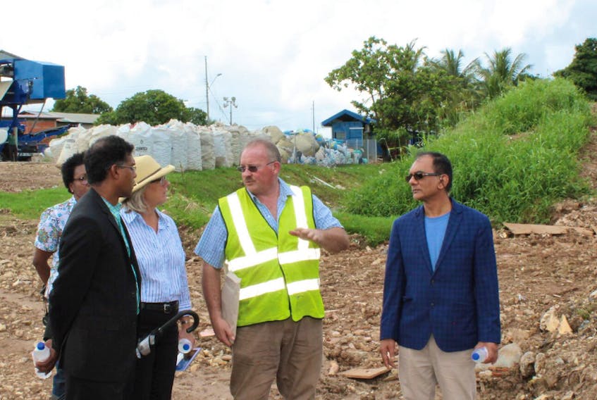 WTS president Glen Sharp (second from right) is accompanied by Shamshad Mohammed, chairman of the Trinidad and Tobago Solid Waste Management Co. Ltd., as he explains how the company’s landfill leachate pilot project works to Carla Hogan Rufelds, Canadian high commissioner to the Caribbean country.