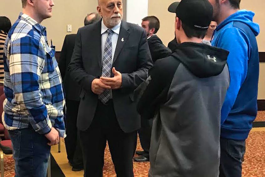 Minister Al Hawkins answers questions by students from the College of the North Atlantic and Academy Canada at the first Newfoundland and Labrador Construction Association student mentorship session.