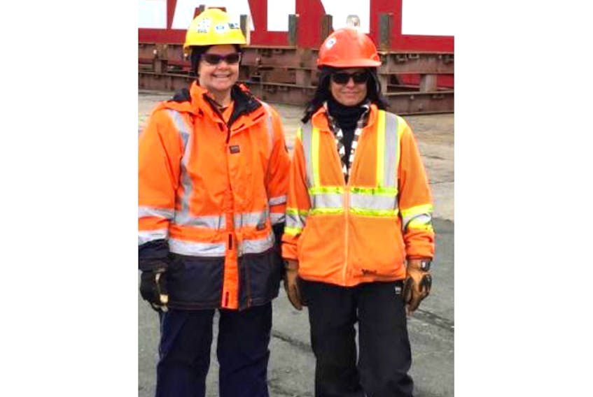 Paula Snelgrove (left) and Michelle Follett are the first women to receive union cards from the Longshoremen’s Protective Union in its 115-year history. They work on the St. John’s waterfront.
