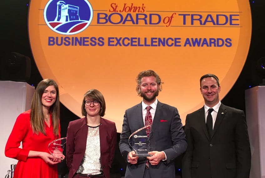 From left, Neala Quigley, Sophie Harrington and Chris Gardner of Sequence Bio, and Tom Handley, manager of government relations for the Insurance Bureau of Canada, who presented the community impact honours.