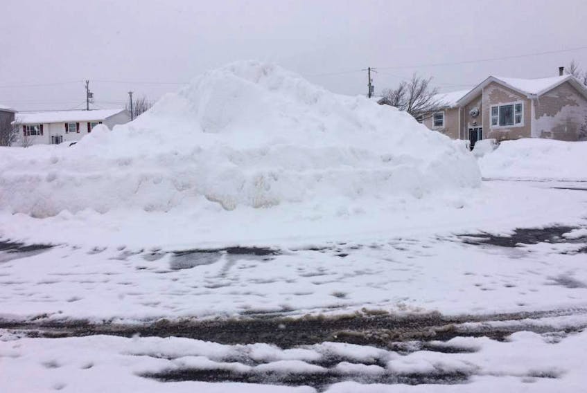 Paradise resident Andrea Newbury raised concerns about this large snowbank — seen here on Tuesday morning — in front of her cul-de-sac home. Kids on the street were playing on the snowbank Monday, and Newbury urged parents everywhere to exercise safety for their children.