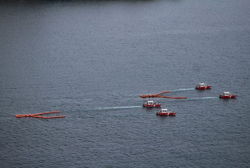 Canadian Coast Guard pollution response vessels tow devices meant to skim oil off the top of the water, called harbour busters, in an exercise Tuesday in Notre Dame Bay at the site of the sunken Manolis L.