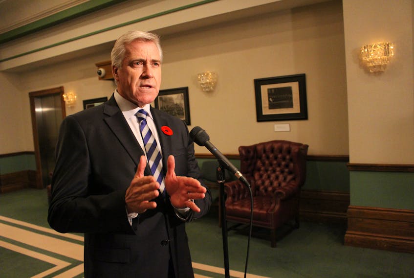 Premier Dwight Ball speaks to members of the media Tuesday afternoon outside the House of Assembly.