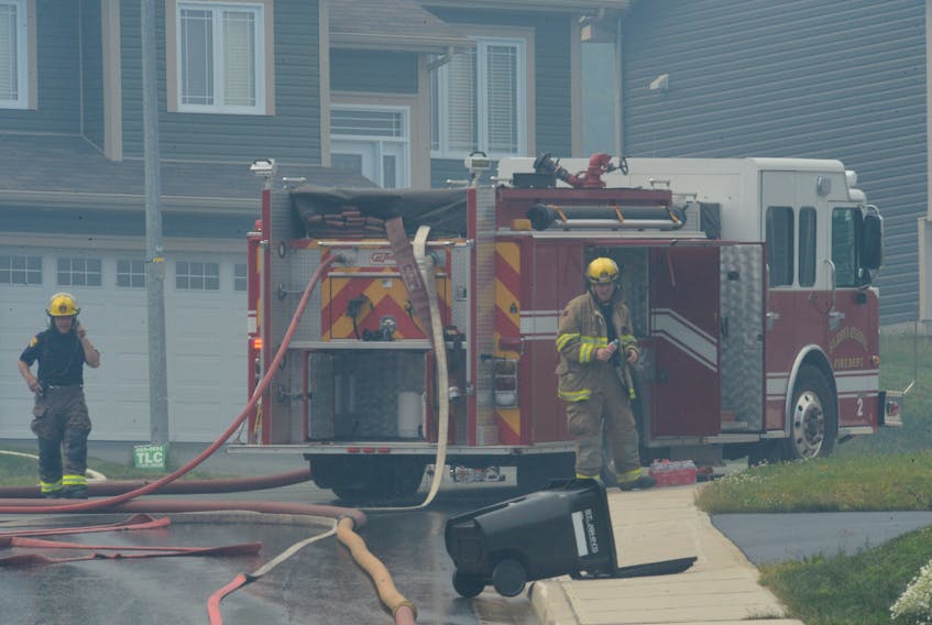 At the height of the Kenmount Terrace fire Monday, thick smoke engulfed the neighbourhood as firefighters battled to save it. —