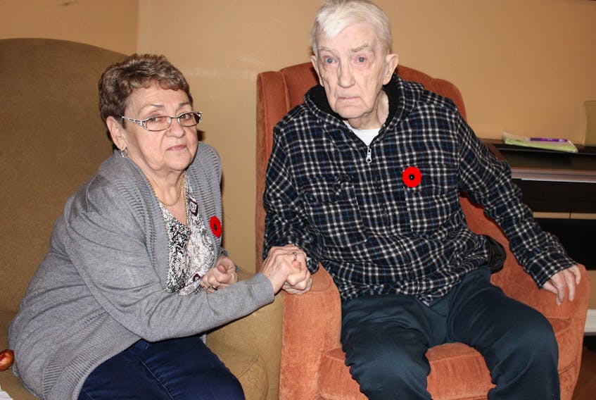 Korean War veteran George Campbell with Theresa Bowen at the Alderwood Retirement Centre in Witless Bay after the facility’s annual Remembrance Day ceremony on Thursday.