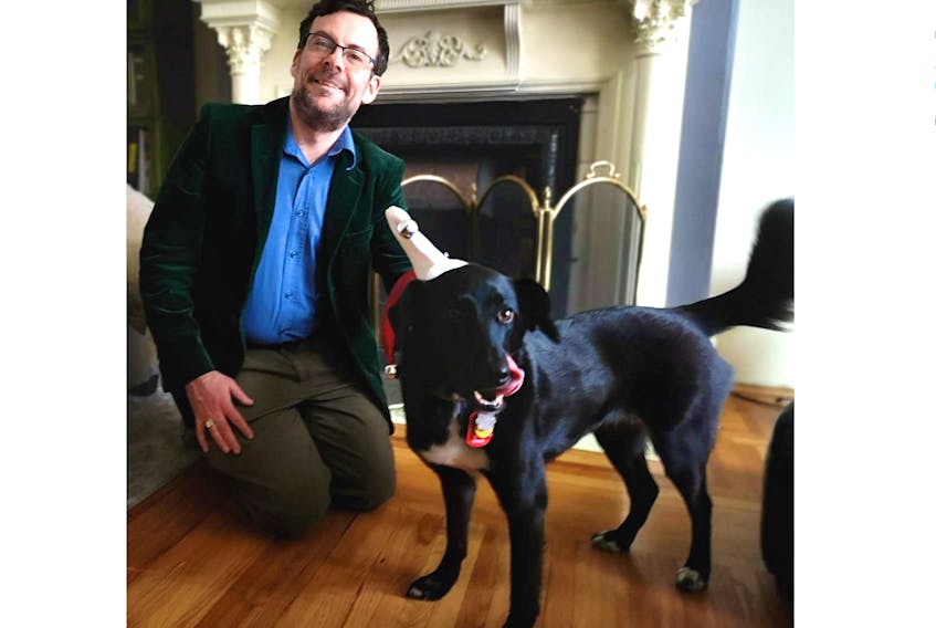 David Brake and his dog, Zoey, will walk the streets of the Georgetown area of St. John’s on Saturday night, knocking on doors and singing carols. And he hopes people will join in.