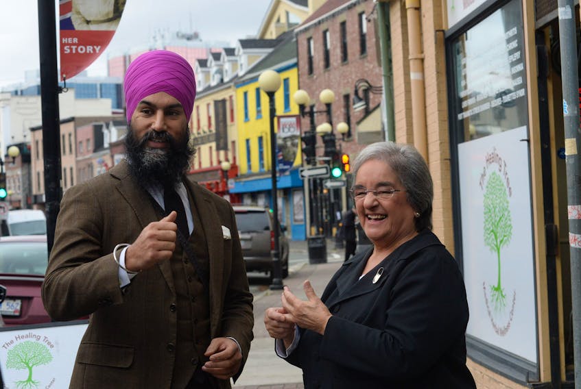 Federal NDP Leader Jagmeet Singh speaks with NDP MHA Lorraine Michael on Tuesday on Water Street in St. John’s.