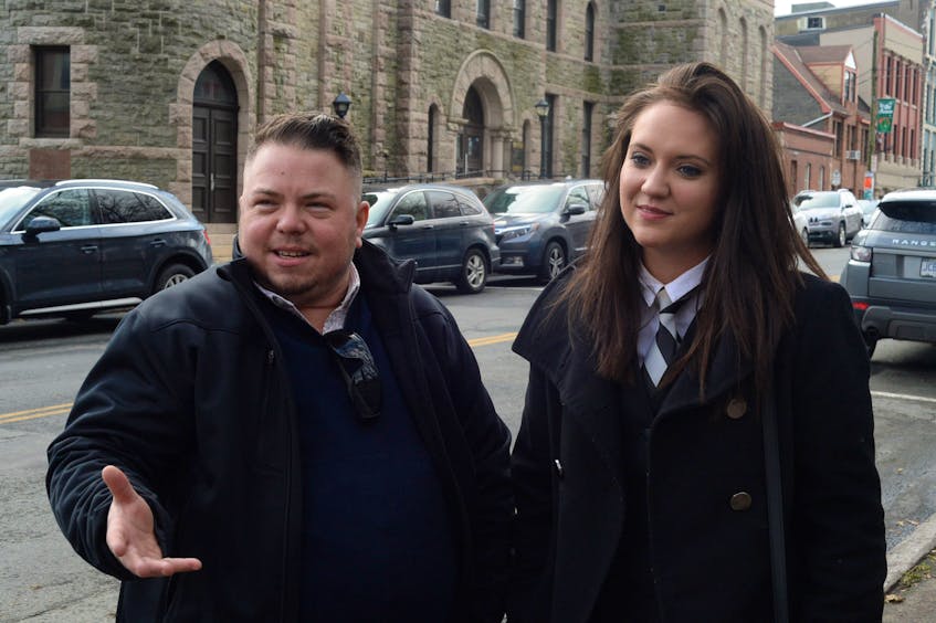Transgender activist Gemma Hickey of St. John’s stands with her lawyer, Brittany Whalen, outside the Newfoundland and Labrador Supreme Court in St. John’s on Thursday before heading to the province’s Vital Statistics Division in Mount Pearl.