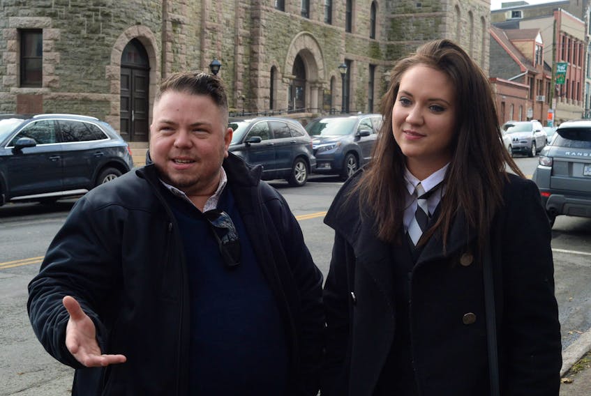 Transgender activist Gemma Hickey of St. John’s stands with her lawyer, Brittany Whalen, outside the Newfoundland and Labrador Supreme Court in St. John’s on Thursday before heading to the province’s Vital Statistics Division in Mount Pearl.