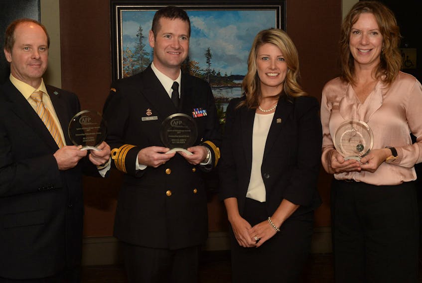 At the awards luncheon Wednesday are Terry Dunn of the Heavy Civil Association of N.L., Cmdr. Scott Nelson of HMCS St. John’s, Rebecca Dutton of the Association of Fundraising Professionals and Gina Pecore of Genoa Design International.