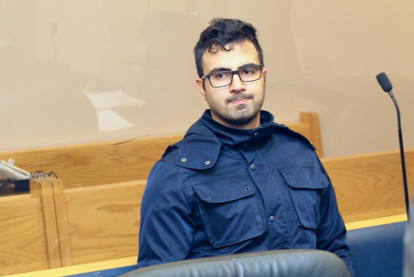 Masih Allahbashkhi, 29, sits in provincial court in St. John’s at the start of his bail hearing Jan. 8. Allahbashkhi, who was charged Jan. 5 with attempting to poison a man he’s alleged to have tried to push off a cliff days later, was released on bail Tuesday. He’ll be back in court Feb. 12.