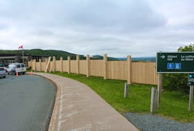 A seven-foot high privacy fence, stretching more than 80 feet in length, has been erected on the south side of the Signal Hill Visitors Centre, sparking outrage from many residents and tourists, who say it blocks the scenic view.
