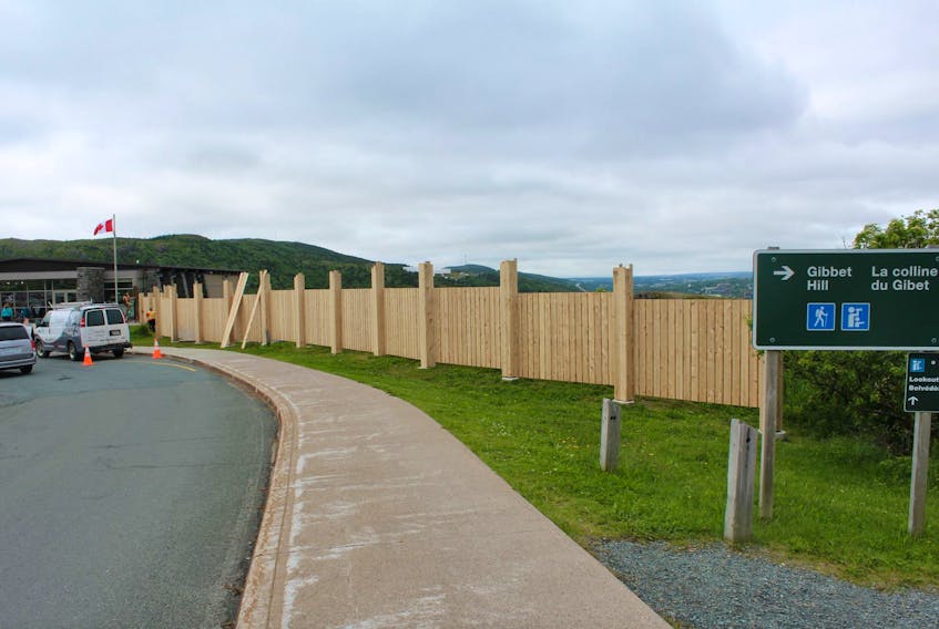A seven-foot high privacy fence, stretching more than 80 feet in length, has been erected on the south side of the Signal Hill Visitors Centre, sparking outrage from many residents and tourists, who say it blocks the scenic view.