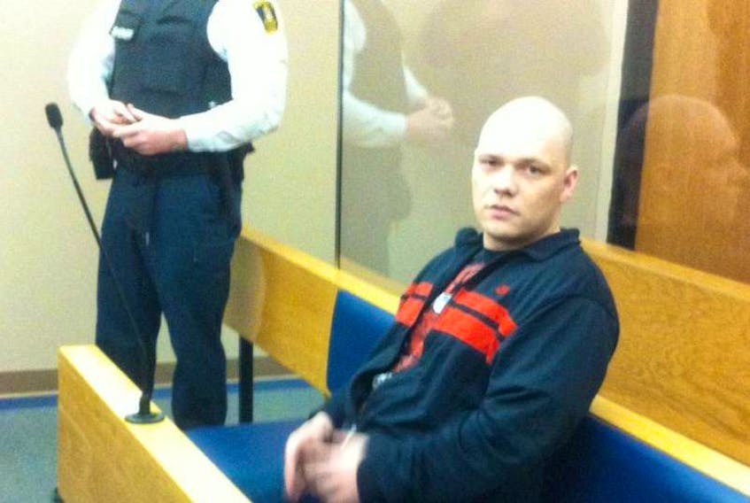 Justin Hopkins sits in court in St. John’s during an earlier appearance.