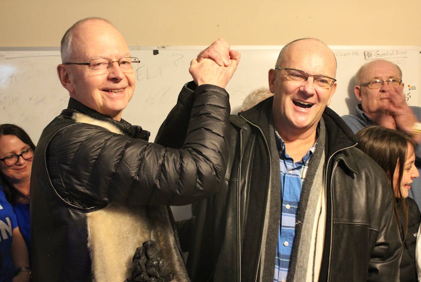 Progressive Conservative Leader Ches Crosbie congratulates Tory candidate Paul Dinn on Thursday night for his victory in the Topsail-Paradise by-election.