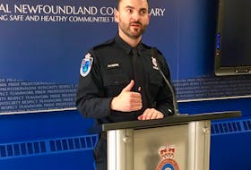 RNC Const. Geoff Higdon speaks to reporters this afternoon at RNC headquarters in St. John’s about a murder that happened earlier today in Labrador city. — Photo by Rosie Mullaley/The Telegram