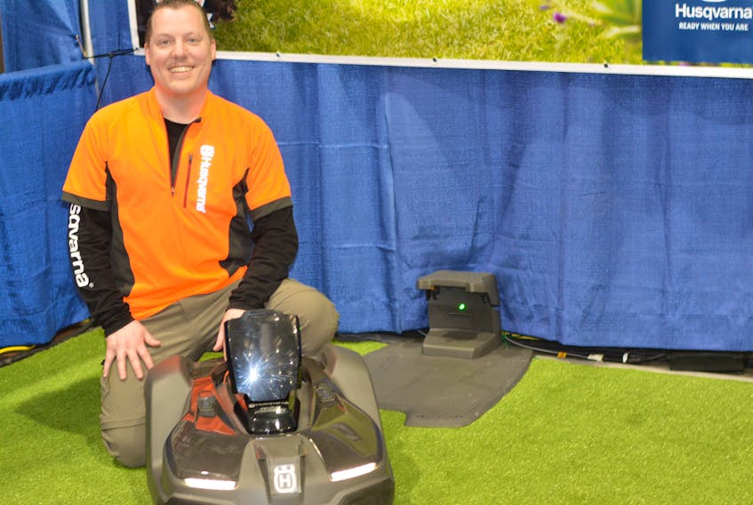 Steve Quinton, Husqvarna’s territory manager for Newfoundland and Labrador, with the Automower, a robotic lawn mower.