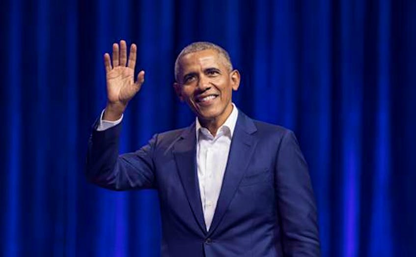 Former U.S. president Barack Obama waves to the enthusiastic crowd at Mile One Centre in St. John’s, Nov. 12. Obama spoke to a sold-out show in Halifax Wednesday night. —