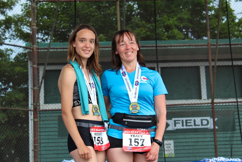 Keaira Lawrence-Pond (left) nominated her mother, Tracy Lawrence (right), for the Dr. John Williams Award at this year’s Tely 10. The annual award is given to a race participant who inspires others through enthusiastic and spirited participation in the annual event. —