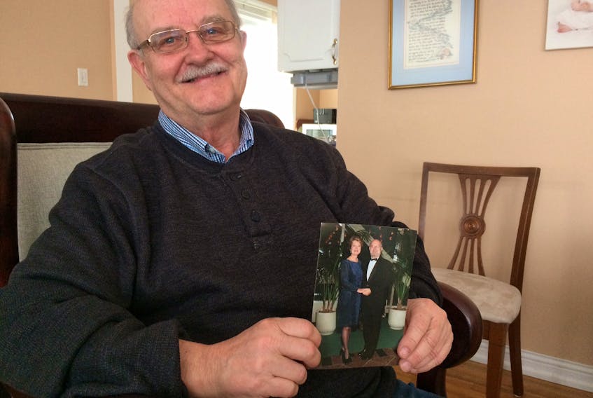 Harold Hefferton holds a photo of he and Barbara taken in Halifax at a travel or tourism event years ago. —