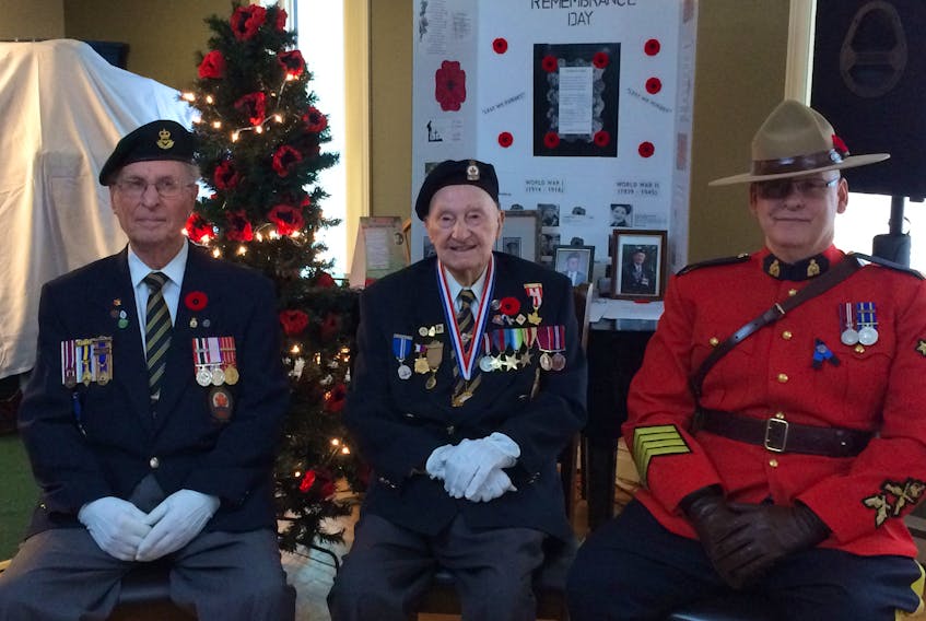 Submitted  — (From left): Irving Wareham, Charles Moores and Staff Sgt. Chris Fitzgerald attending a Remembrance Day ceremony at Meadow Creek Retirement on Saturday morning.