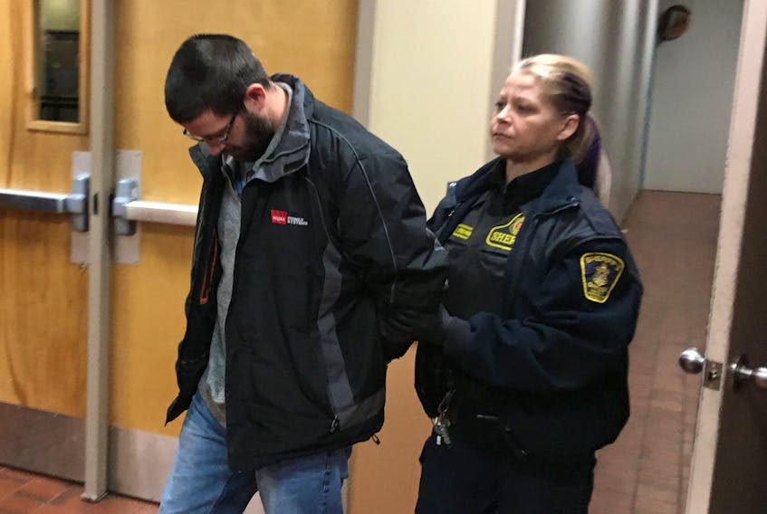 Steve Bragg, 35, is led into provincial court Dec. 23 to face a second-degree murder charge in the death of Victoria Head. —David Maher/The Telegram