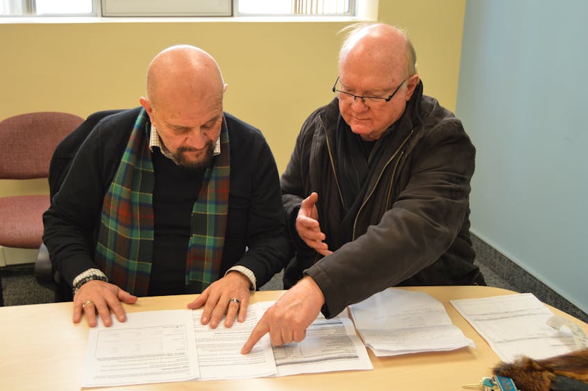 John Aylward, left, a development consultant, and Bill Campbell, president of the Kings Square Affordable Housing Corporation, say plans are to break ground in June on a 50-unit series of affordable housing buildings in Charlottetown.