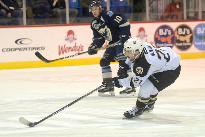 Charlottetown Islanders left-winger Pascal Aquin picks up the puck after eluding a hit at centre ice Thursday at Eastlink Centre.