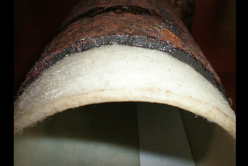 An example of a metal pipe lined with a new, cured-in-place resin plastic pipe.  ©Photo by Trenchless Pipe Lining, a division of Maddrey Enterprises Inc.