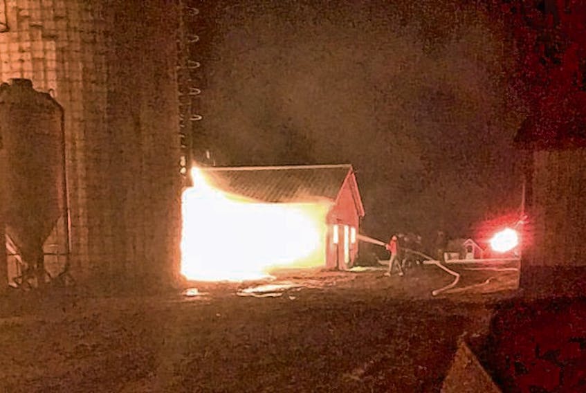 Farmhand Nick Pettipas snapped these photos of the Riverview Dairy’s pole barn as fire raged early Sunday.