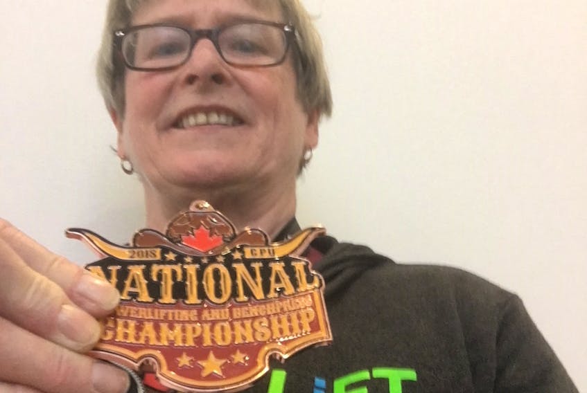 Powerlifter  Arlene van Diepen shows off her bronze medal won at the national powerlifting championships in March. van Diepen, who’s from Green Meadows, qualified for the IPF world classic powerlifting championships which run June 6-17 in Calgary, Alta.