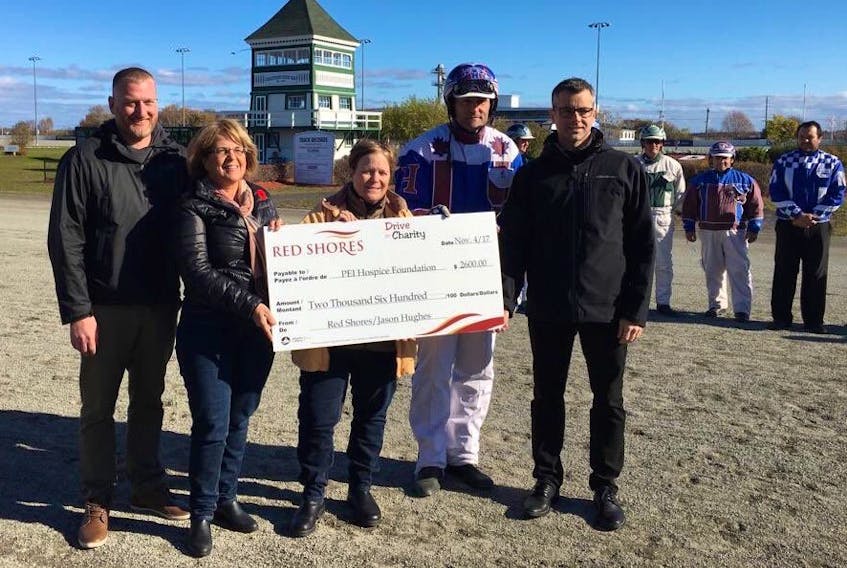 The P.E.I. Hospice Foundation received a $2,600 cheque Saturday as part of the Drive for Charity. From left are Red Shores race manager Adam Walsh, Lorna Jenkins and Nancy Marie Arsenault from the P.E.I. Hospice Foundation, driver Jason Hughes and Michael MacKinnon, managing director for Red Shores. Submitted photo