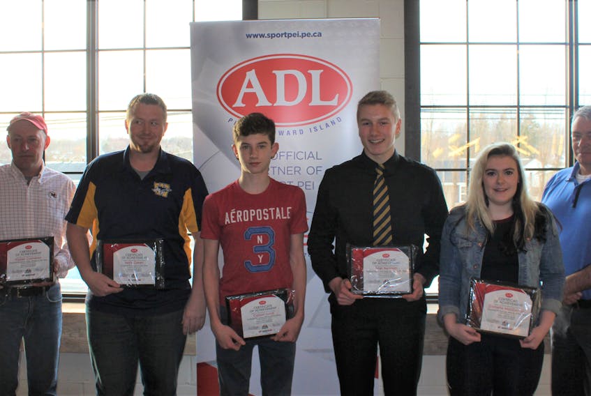 Sport P.E.I./ADL certificates of achievement were recently presented at Football P.E.I.’s awards banquet. From left are Jason Cameron, representing his son Parker Cameron (senior male athlete of the year), Mark Green (coach of the year), Carson Lund (junior official of the year), Tyler Newson (junior male athlete of the year), Danielle MacDonald (female athlete of the year) and ADL representative Mike Eyolfson.