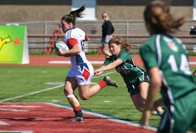 Acadia fullback Alysha Corrigan outruns an attempted tackle by UPEI’s Maddy Shea (#15) in Atlantic University Sport women’s rugby action earlier this season in Wolfville, N.S. Corrigan, a former Panthers standout, and the Axewomen land Saturday at UPEI for a matchup against the Panthers.
