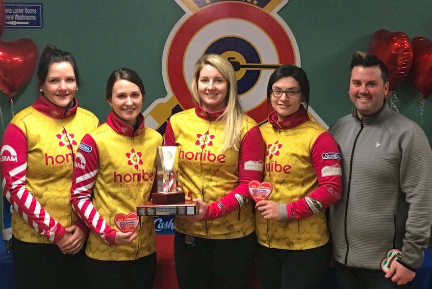 The Robyn MacPhee rink from the Charlottetown Curling Complex rink display their P.E.I. Scotties Tournament of Hearts trophy after a 6-2 win over the Lauren Lenentine foursome Sunday in Cornwall. The MacPhee rink includes, from left, skip Robyn MacPhee, third Sarah Fullerton, second Meaghan Hughes, lead Michelle McQuaid and coach Mitch O’Shea.