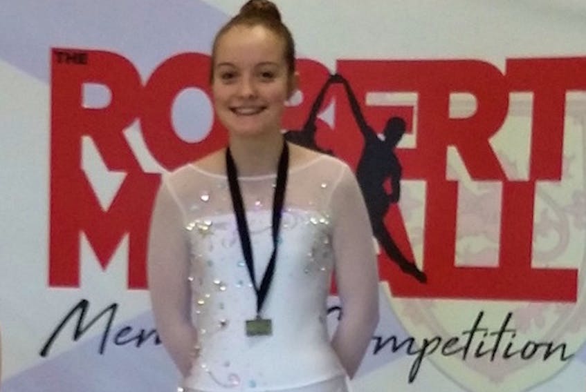 Kaitlyn Smith of the Summerside Figure Skating Club, centre, displays her gold medal won in the pre-juvenile women’s under-13 division at the recent Robert McCall memorial competition in East Hants, N.S. Overall, Island figure skaters returned with eight medals.