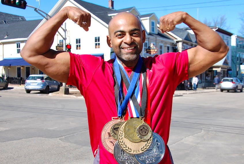 Christo Jose of Charlottetown poses with his medals he’s won since 2016 on the Maritime bodybuilding scene since 2016.
